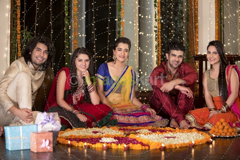 couples celebrating diwali and decorating home