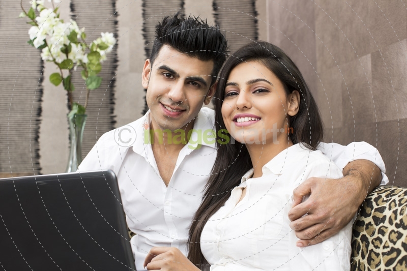 young couple posing at home
