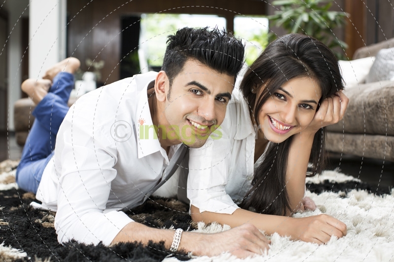 couple smiling and having leisure time at home