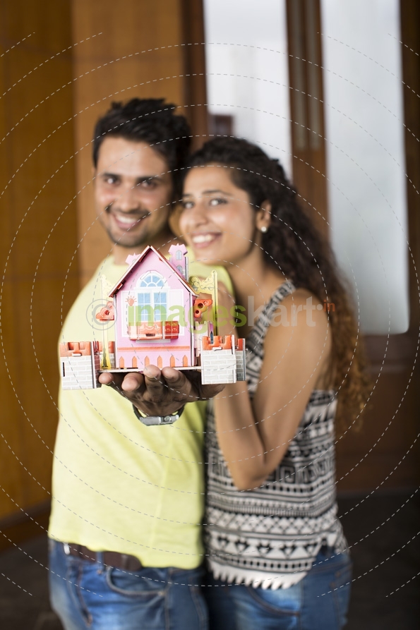 couple posing with home miniature