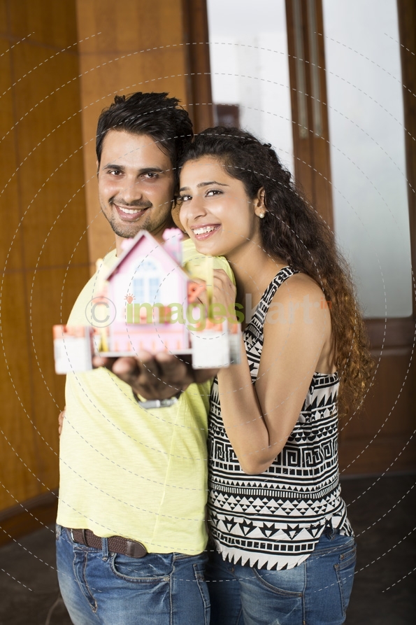 couple posing with home miniature