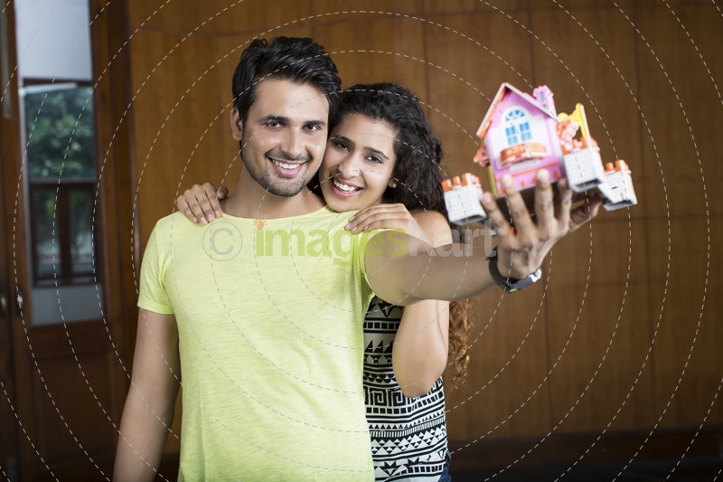 couple posing with home miniature