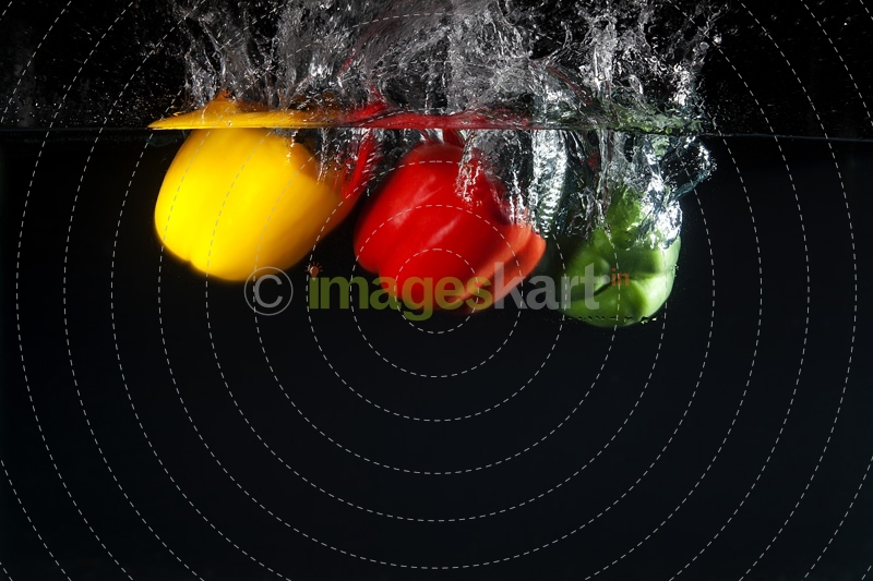 coloured capsicums in water 
