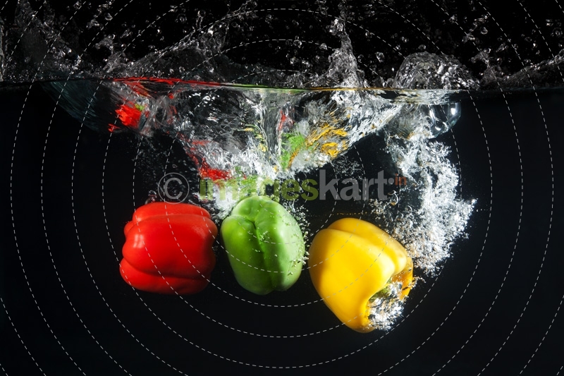 coloured capsicums in water 