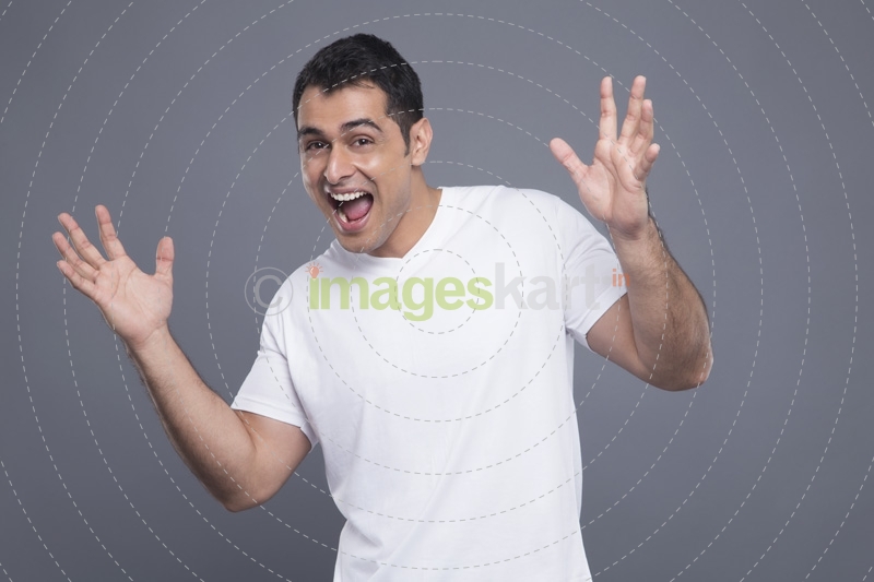 surprised man in white t shirt 