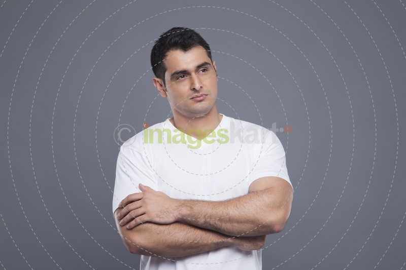 man in white with hands folded