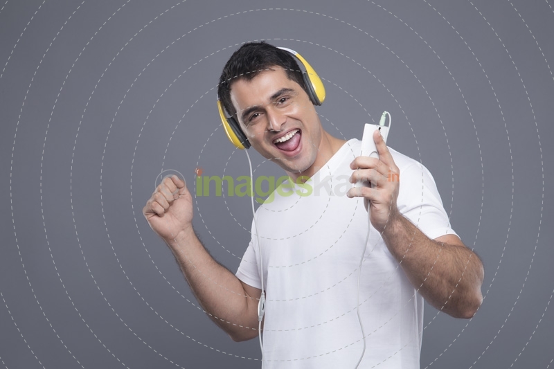 man listening to music on phone