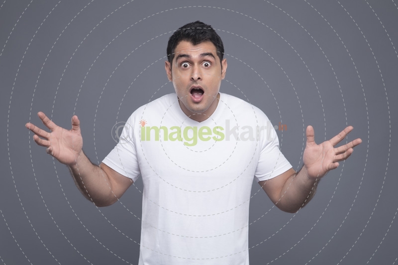surprised man in white t shirt