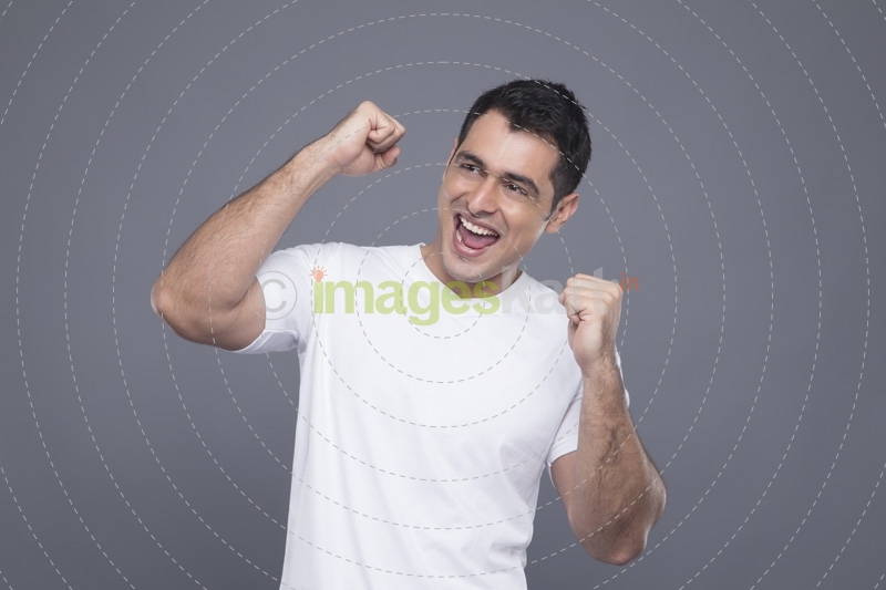 man in white cheering 