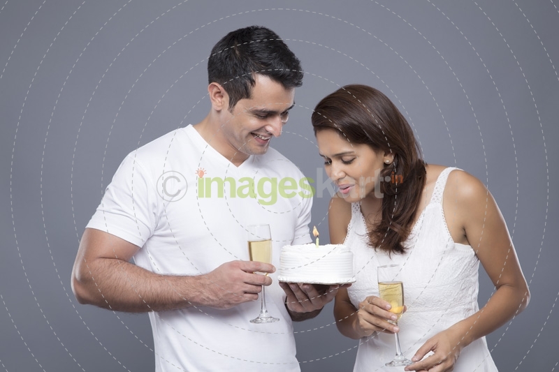 couple celebrating birthday with champagne