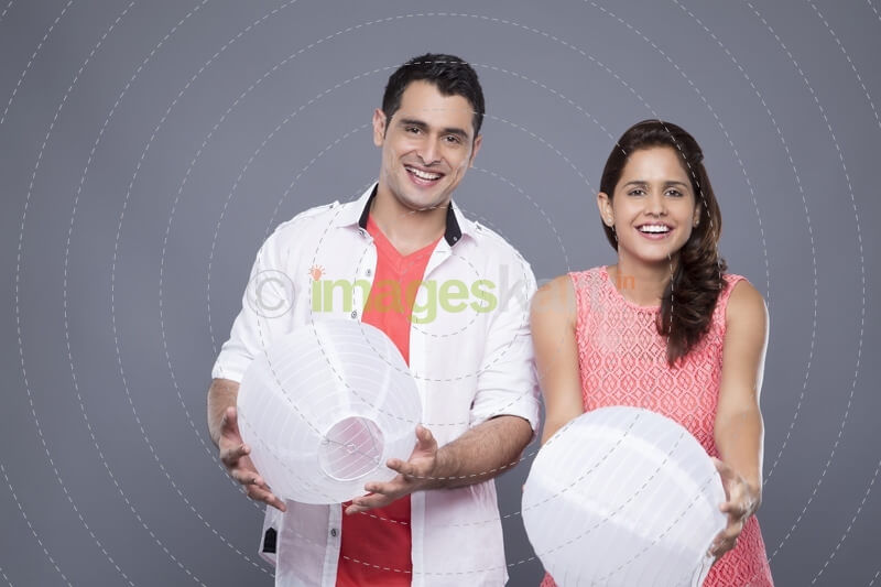 couple holding lamps