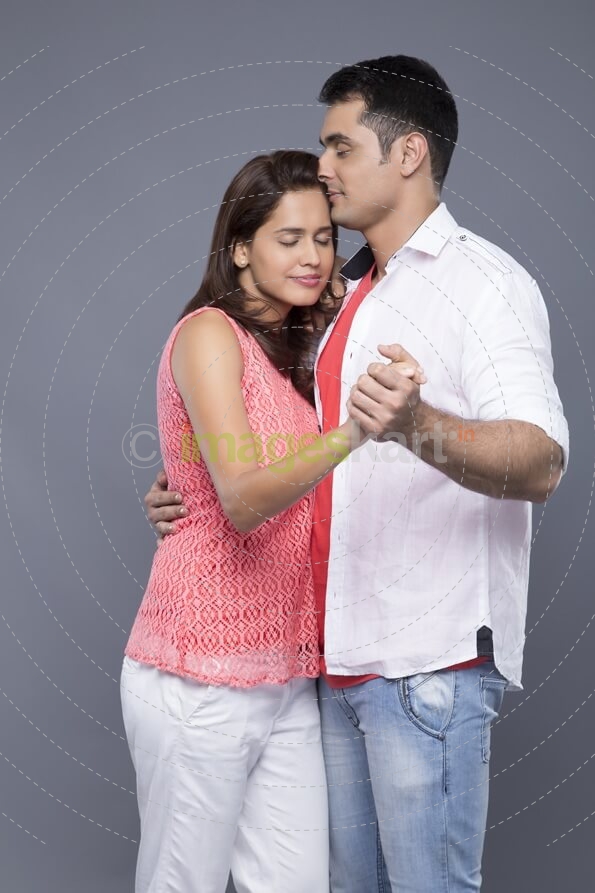 couple dancing with eyes closed 