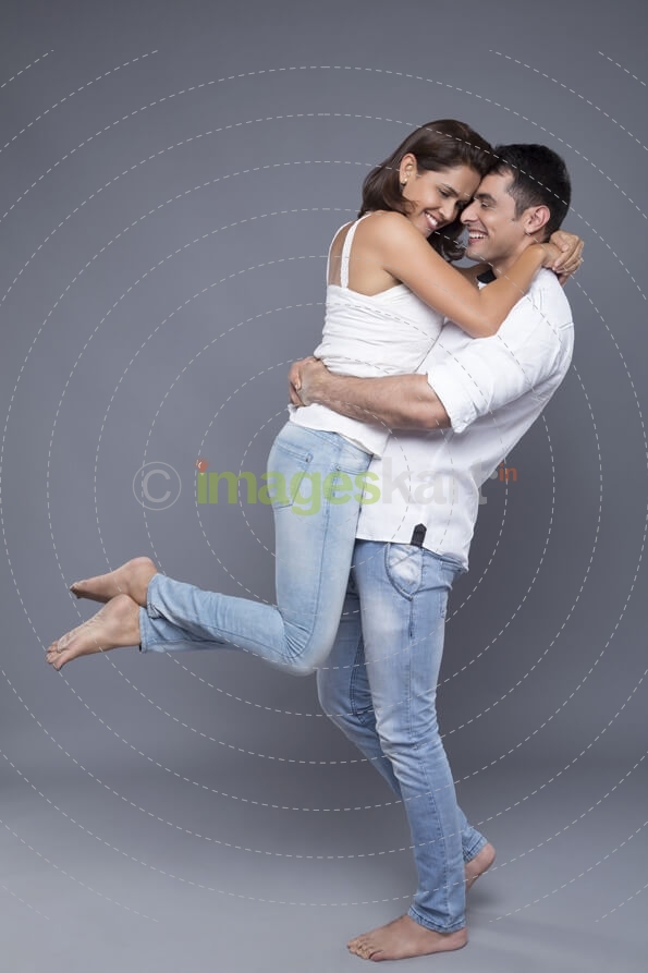 man lifting woman out of love 
