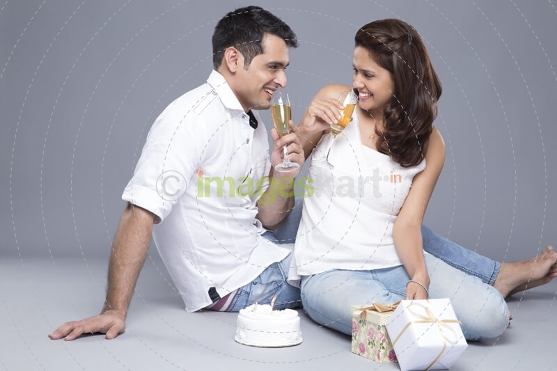 couple celebrating with champagne 