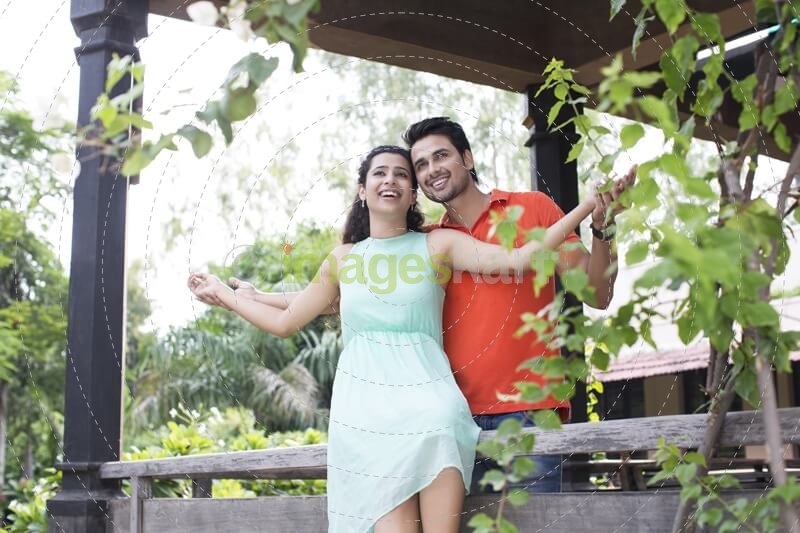 couple enjoying the weather in the balcony