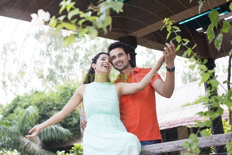 couple enjoying the weather in the balcony