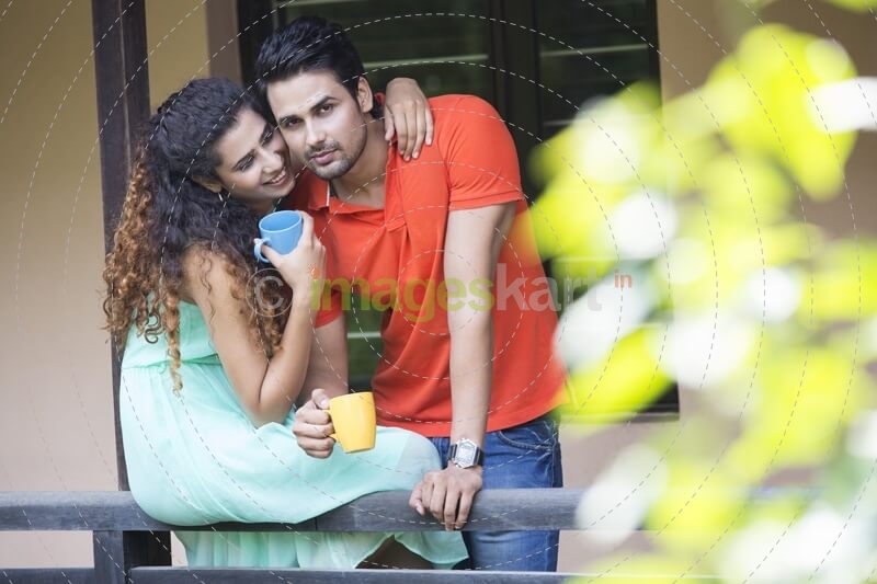 couple having coffee on the balcony