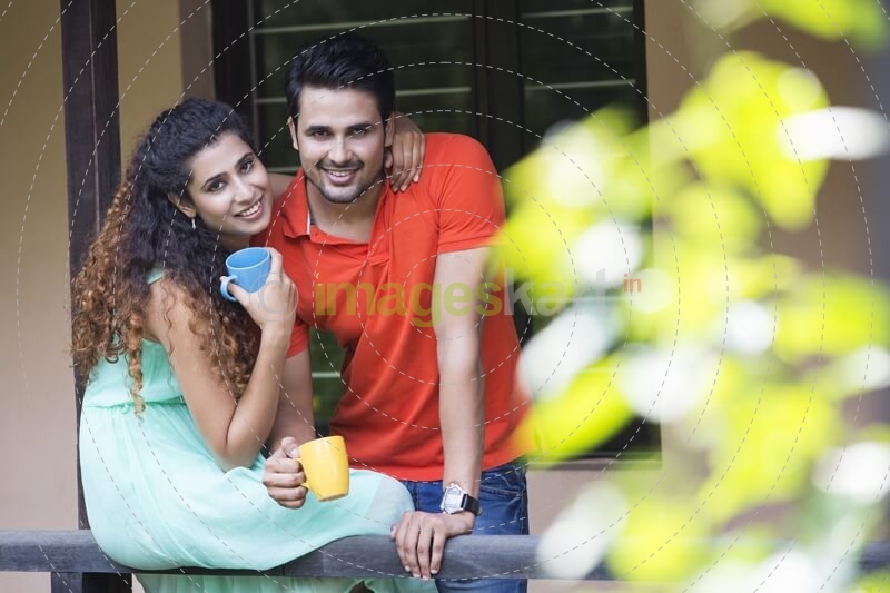 couple having coffee on the balcony