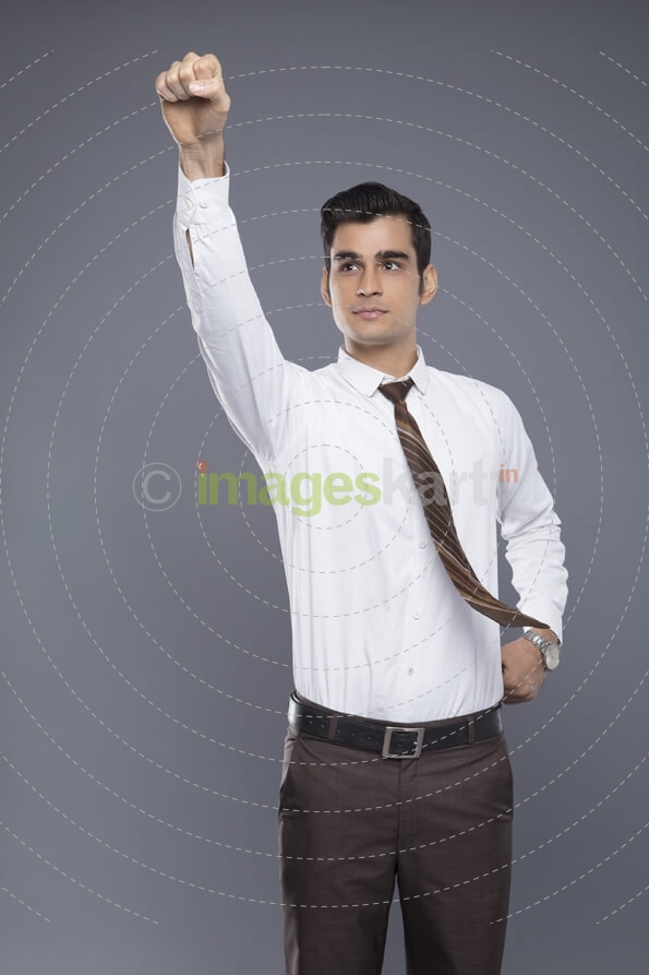 man pointing fist in air 