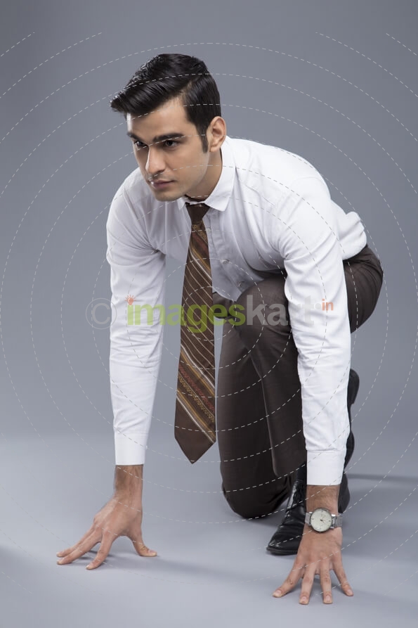 professionally dressed man ready to run