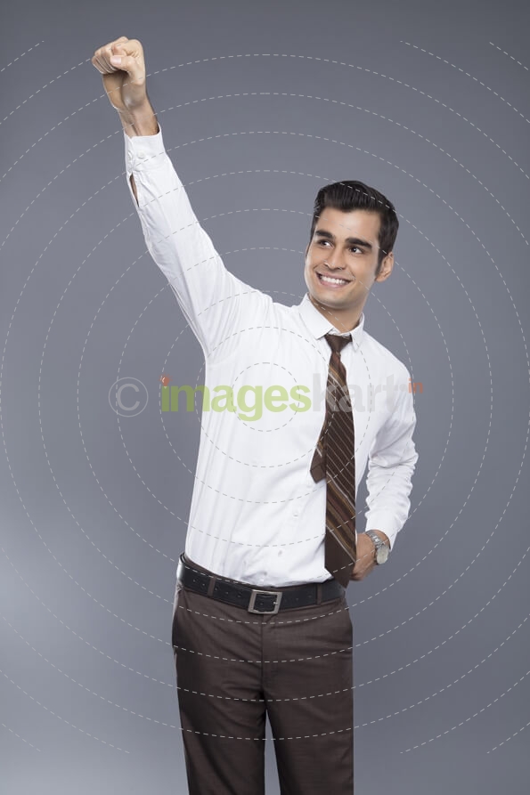 man pointing fist in air 