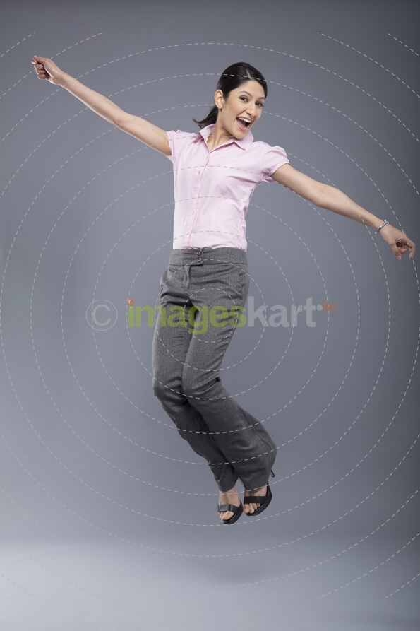 professional woman jumping in the air