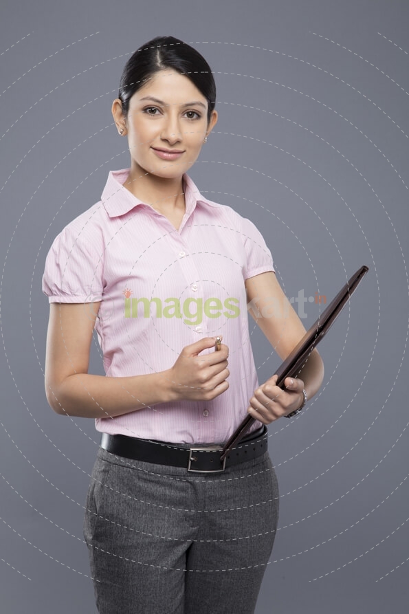 portrait of a businesswoman holding a file