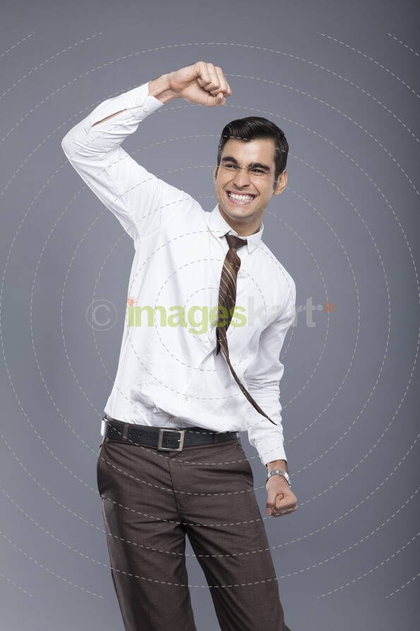 man in formal clothes cheering
