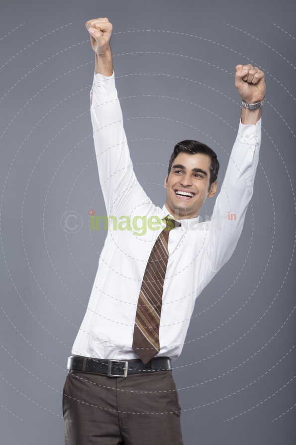 man in formal clothes cheering