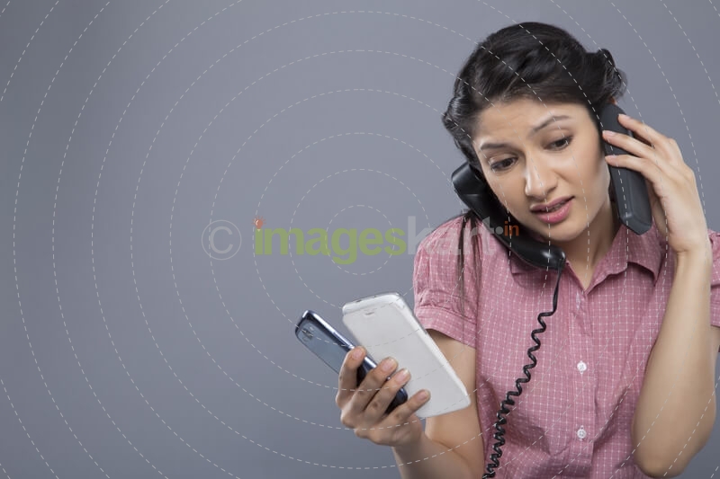busy woman working and answering a lot of calls at the same time