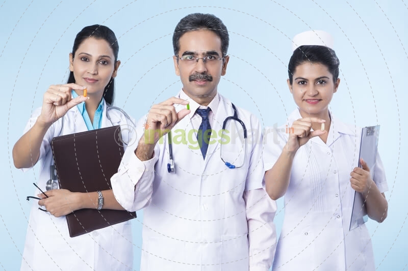 team of doctors giving medicines 