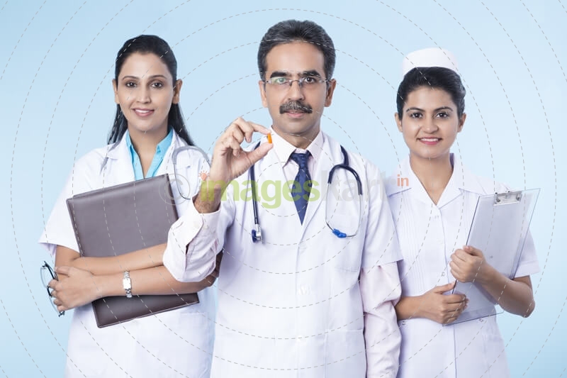 team of doctors giving medicines 
