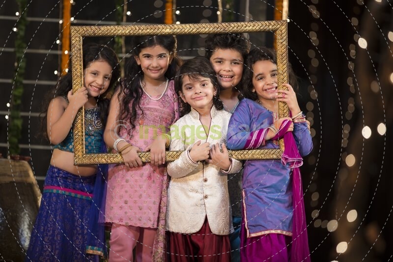 cheerful small group of kids holding a picture frame