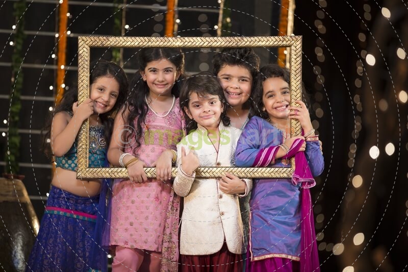 cheerful small group of kids holding a picture frame
