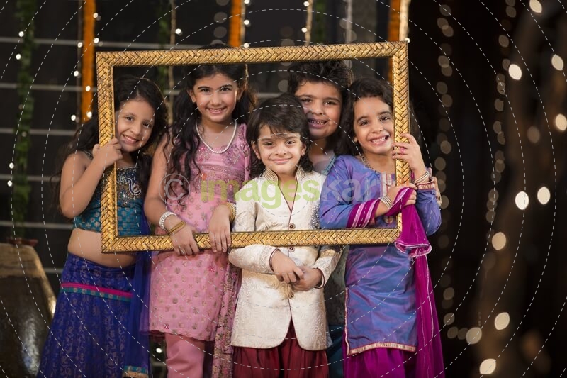 cheerful small group of kids holding a picture frame