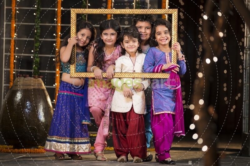 cheerful small group of kids holding a picture frame