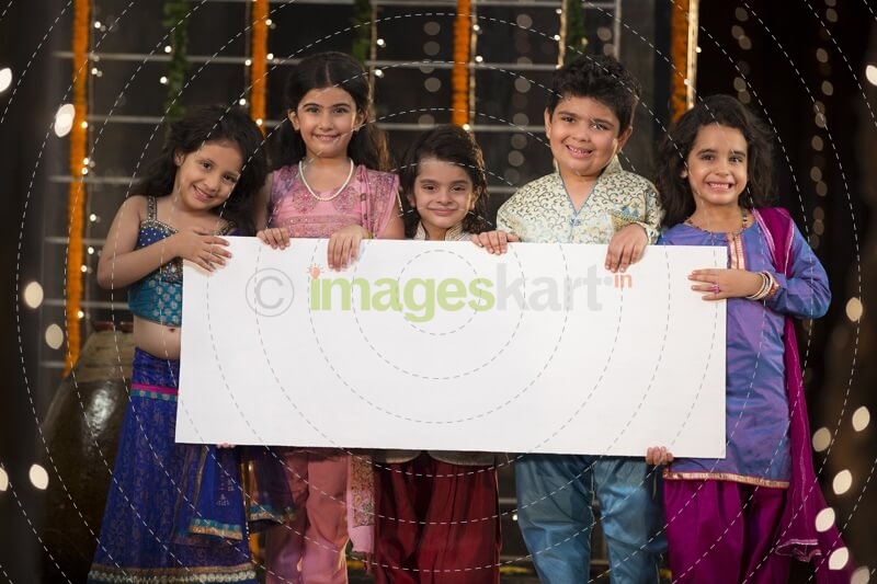 cheerful small group of kids holding a message board