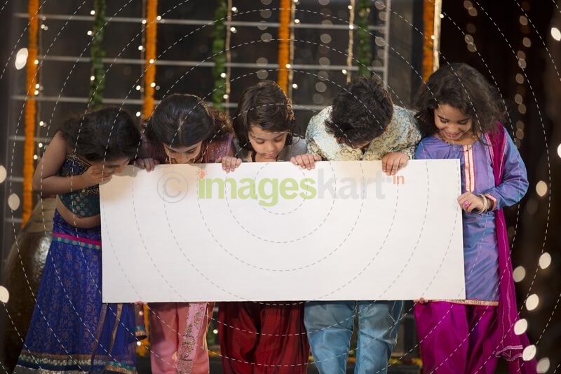 cheerful small group of kids holding a message board