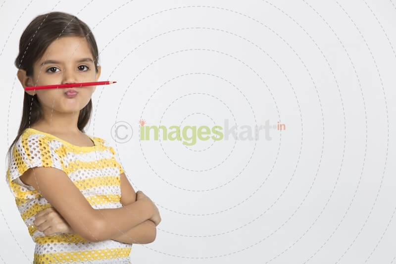 young girl with pencil 