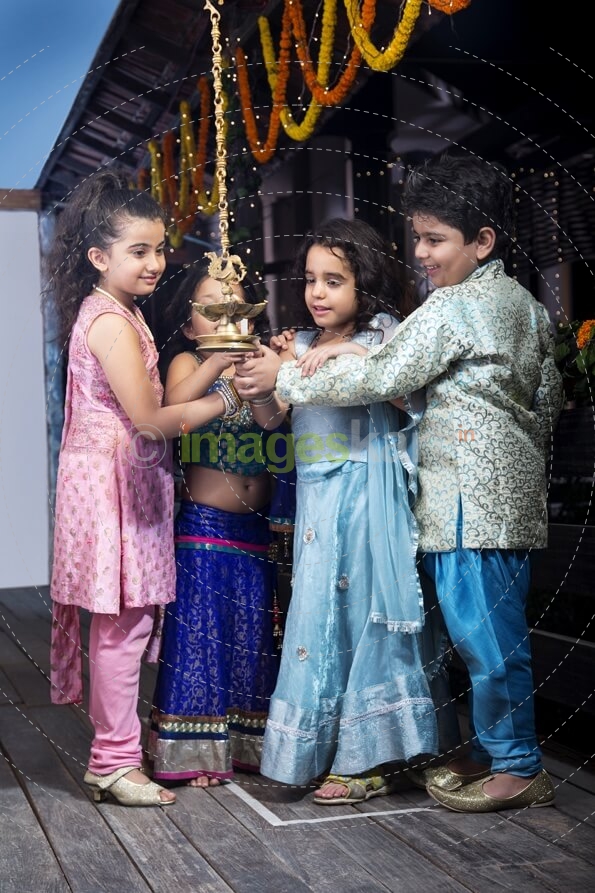 kids lighting diya
