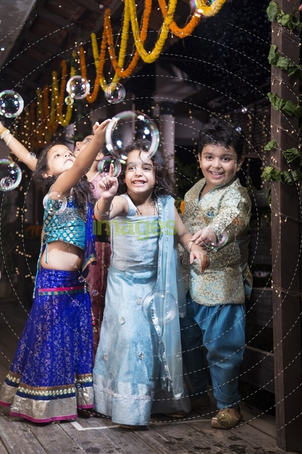 kids playing with water bubbles  