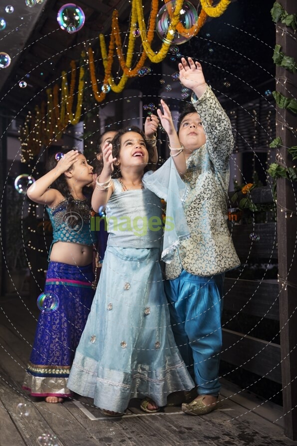 kids playing with water bubbles  
