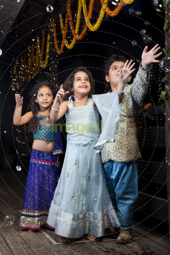 kids playing with water bubbles   