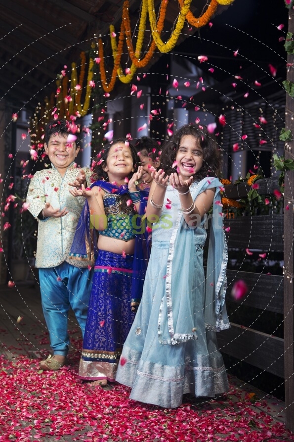 kids playing with rose petals on diwali 