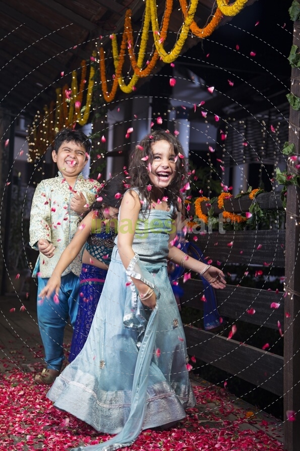 kids playing with rose petals on diwali 