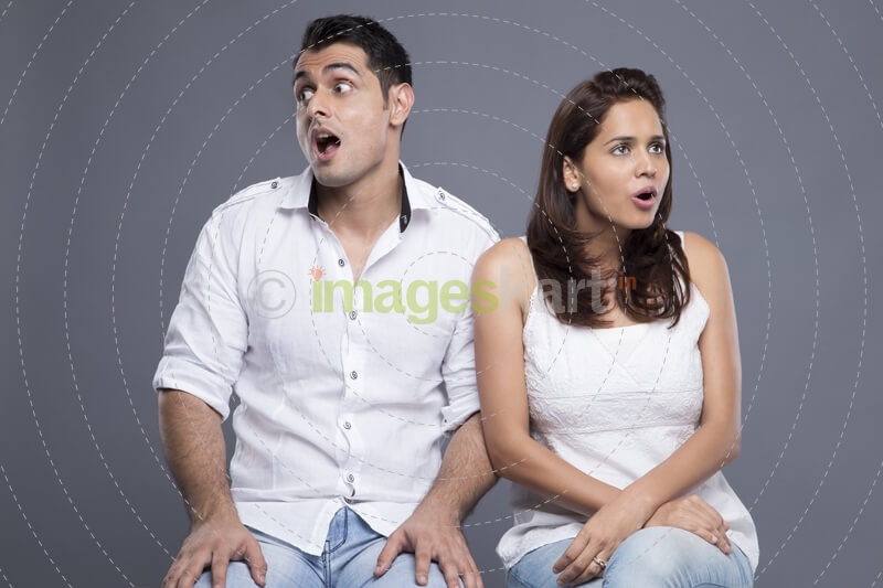couple sitting in white clothing