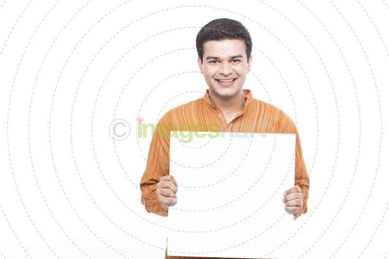 man in kurta holding placard