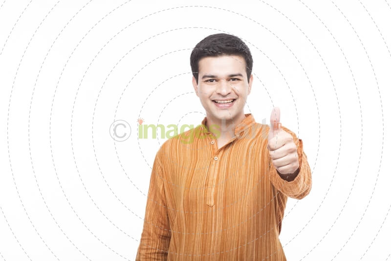 man in kurta showing thumbs up