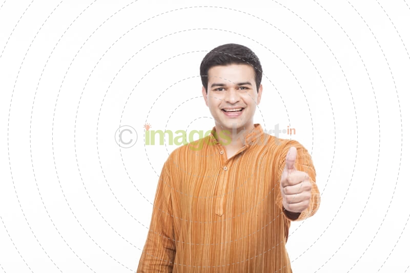 indian man in kurta showing thumbs up