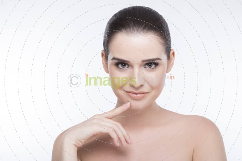 girl with perfect skin looking at the camera while posing